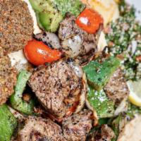 Shish Kabob Dinner · Grilled chunks of tenderloin tips, onion, peppers, tomato served with 2 falafel patties, tab...
