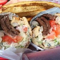 Gyro Wrap · A lean blend of lamb and beef carved off the rotisserie, topped with lettuce, tomato, onion,...