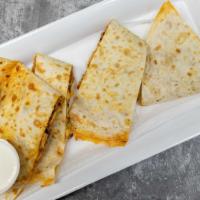 Grilled Chicken  Quesadillas · Chicken, onions pepper, cheddar cheese, and sour cream.