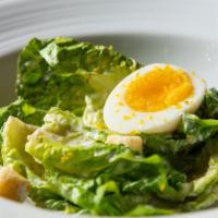 Caesar Salad · Baby Romaine lettuce, Parmigiano-Reggiano, bottarga, and soft-boiled egg.