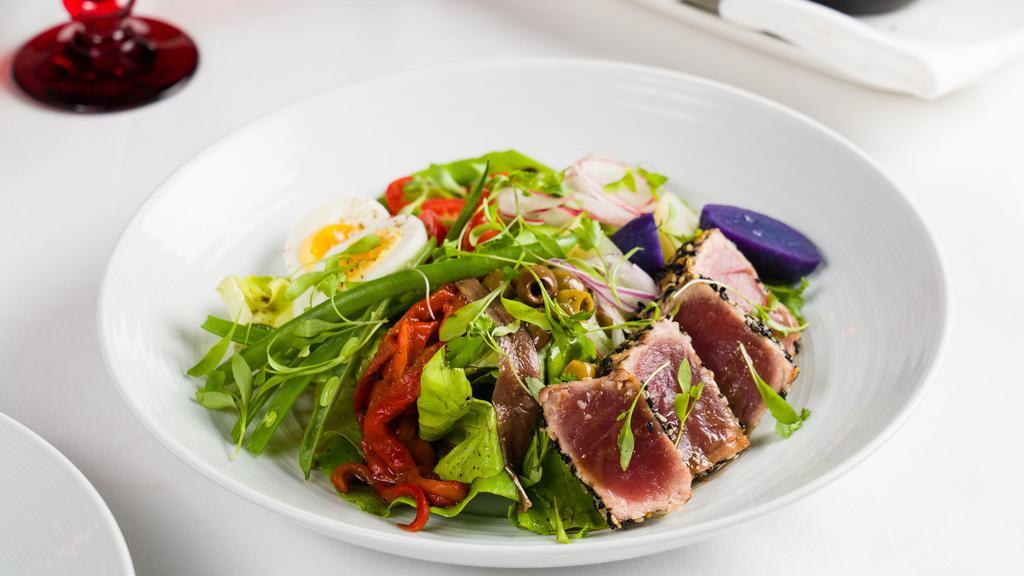 Nicoise Salad* · Petite green beans, cherry tomatoes, tuna, hard-boiled eggs, and olives.