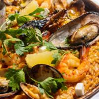 Our Seafood Paella* · Mix seafood, basmati rice, and herbs.