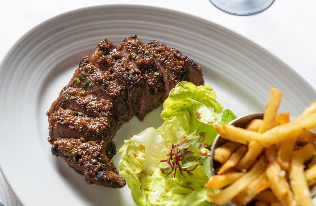 New York Strip Steak* · Prime NY strip steak, black truffles, whole grain mustard, and potatoes.