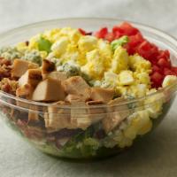 Rotisserie Chicken Cobb · Chicken breast, bacon, tomatoes, blue cheese, boiled egg, and avocado with tarragon-buttermi...