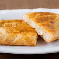 Burek Individual Roll · Choice: cheese, spinach, beef, potato, apple or cabbage.