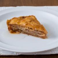 Baklava · Layers of phyllo dough with crushed walnuts smothered in traditional syrup.