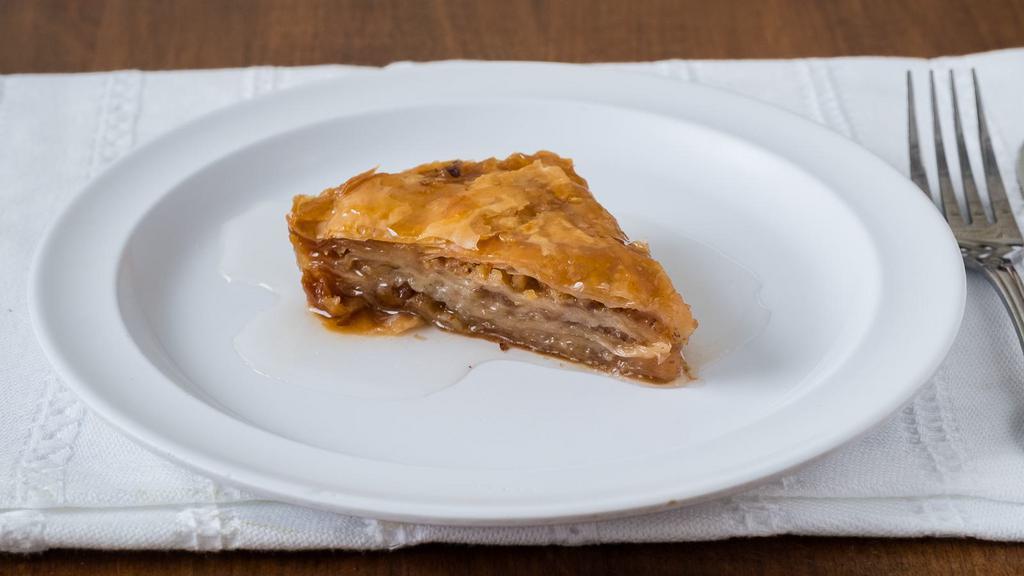 Baklava · Layers of phyllo dough with crushed walnuts smothered in traditional syrup.