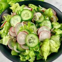 House Salad · Crisp lettuce, tomato, cucumber, black olive, red onion.