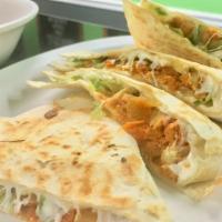 Quesadilla Tinga · Popular. Chicken cooked with tomatoes, onions and chipotle peppers, topped with lettuce and ...