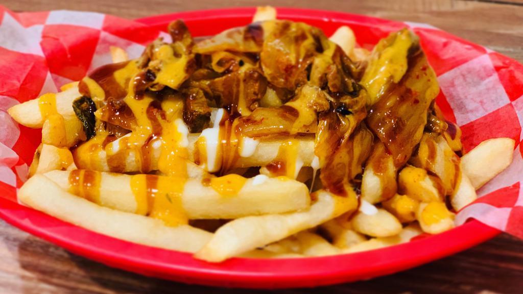 K. Rowling Fries · Japanese, korean style french fries with pork belly, kimchi with cheese, spicy mayo and teriyaki sauce.