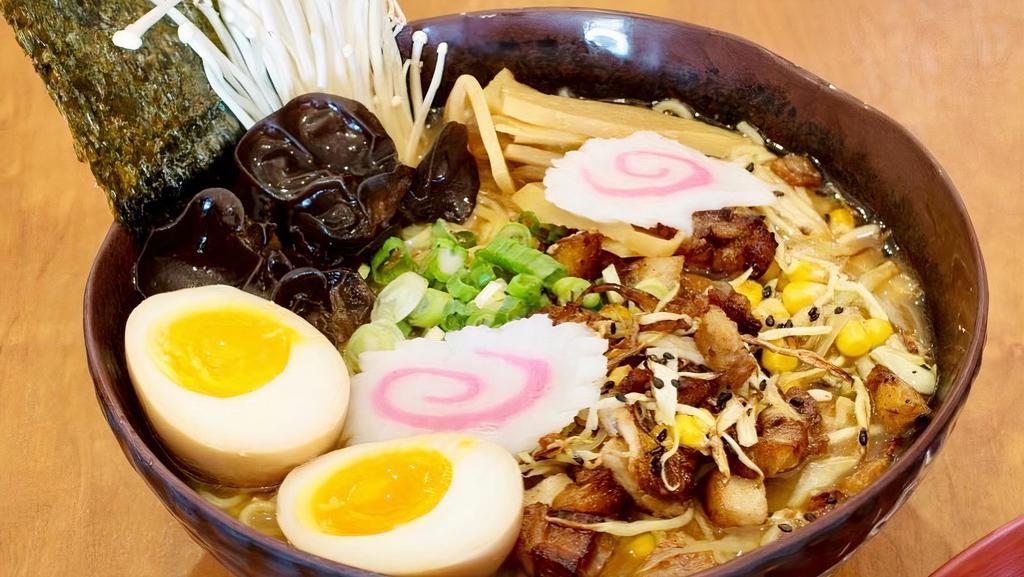 Miso Ramen Bowl · 7 hour chicken broth, chopped pork, cabbage, corn, soft boiled egg, scallions, wood ear mushrooms, bamboo shoots, naruto, nori, bean sprout and crispy onion. Topped with sesame seeds.
