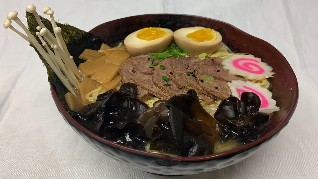Beef Ramen Bowl · 7 hour chicken broth, topped with beef, soft-boiled egg, scallions, wood ear mushroom, bamboo shoots, naruto, nori, bean sprout, savory sauce topped with sesame seeds.