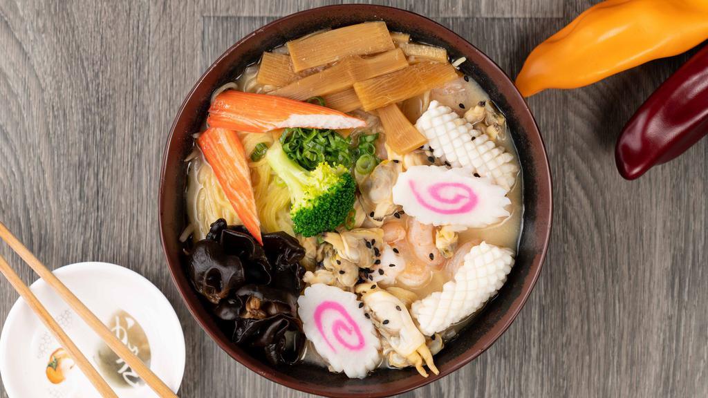 Seafood Ramen Bowl · 7 hour chicken broth, topped with squid, clam, shrimp, crab stick, fish cake, scallion, wood ear mushroom, bean sprout topped with sesame seeds.