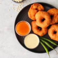 Masala Vada · Spiced & crunchy fritters made of bengal gram dal, served with sambar & coconut chutney.