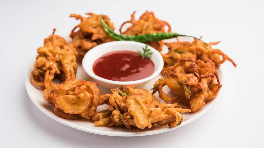 Pakoda · Mildly spiced, chickpea flour vegetable fritters, served with tangy & spicy chutney. Served in customer's choice of flavor.