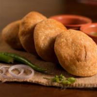 Kachori · Gujarati snack made of different pea fritters served with tangy & spicy chutney.
