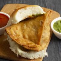 Samosa · Crisp turnovers filled with spiced potatoes & peas, served with tangy & spicy chutney.