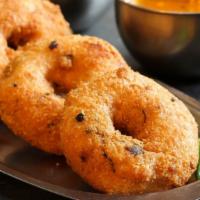 Dahi Vada · Gujarati style fried lentil donuts soaked in spiced yogurt & topped with cilantro chutney & ...