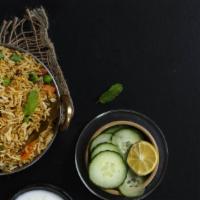 Mixed Vegetable Biryani · Basmati rice cooked with spiced vegetables & served with raita.