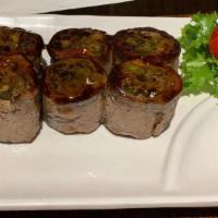 Beef Negimaki · Broiled rolled beef with scallion in teriyaki sauce.