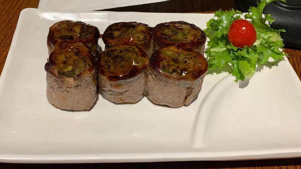 Beef Negimaki · Broiled rolled beef with scallion in teriyaki sauce.