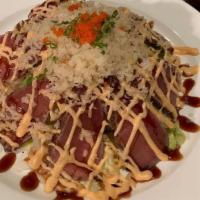 Pepper Tuna Salad · Seared black pepper tuna with crunch and lettuce, spicy sauce and eel sauce on the top.