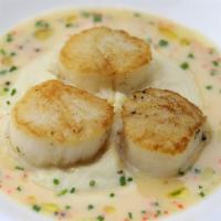 Pan Roasted Dry Boat Scallops · Celery root purée and caviar beurre blanc.