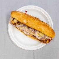 Philly Cheese Steak · Steak, provolone, grilled caramelized onions, and aioli on a sub wrap roll.
