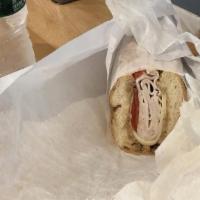 House Roast Turkey Hot Sandwich · Grilled turkey, lettuce and tomatoes with black peppers and salt, mayo on a sub wrap roll.