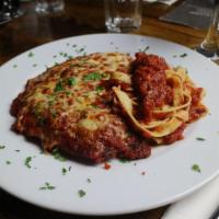 Chicken Parmigiana · Breaded with panko and topped with fior di latte,  served with penne