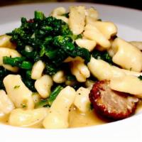 Cavatelli · Homemade cavatelli tossed in a garlic & oil with sausage and broccoli rabe