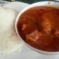 Domada Djen · Tomato sauce with fish or fish ball, served with white rice.