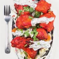 Chicken Tandoori · Chicken marinated in spices, prepared in a clay oven
with meat and on the bone