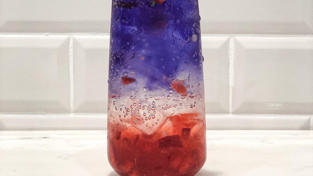 Galaxy-Ade · Iced only. House made strawberry jam, with butterfly pea tea, club soda. Please shake well before drinking.