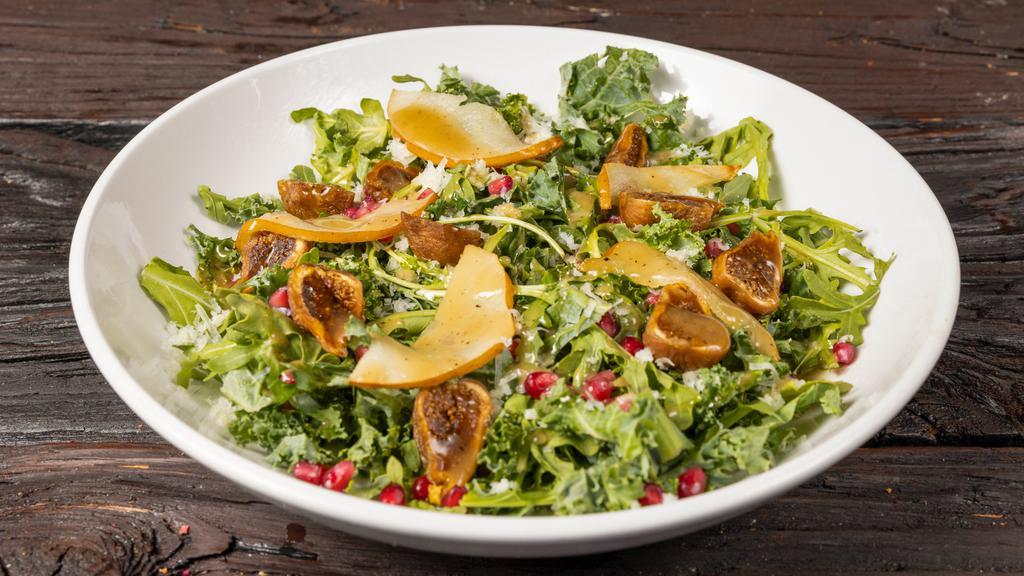 Fig And Pear Salad · Dried figs, Asian pear, pomegranate seeds, argula, baby kale, shredded manchego and fontina blend and sherry vinaigrette.