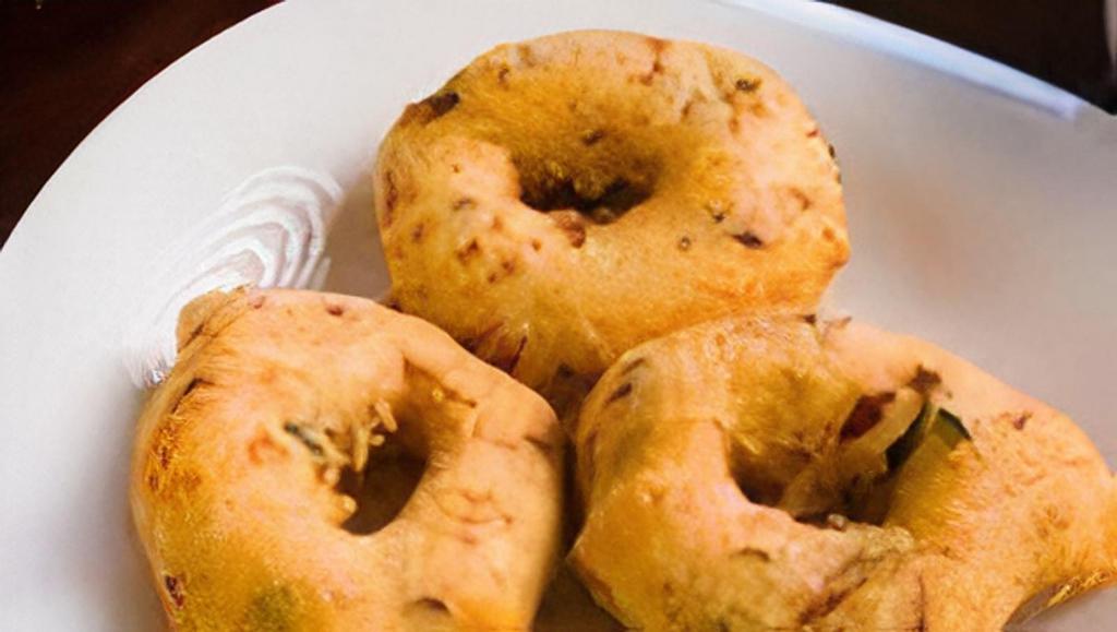 Medhu Vada (2 Pieces) · Fried lentil doughnuts served with sambar and chutneys.