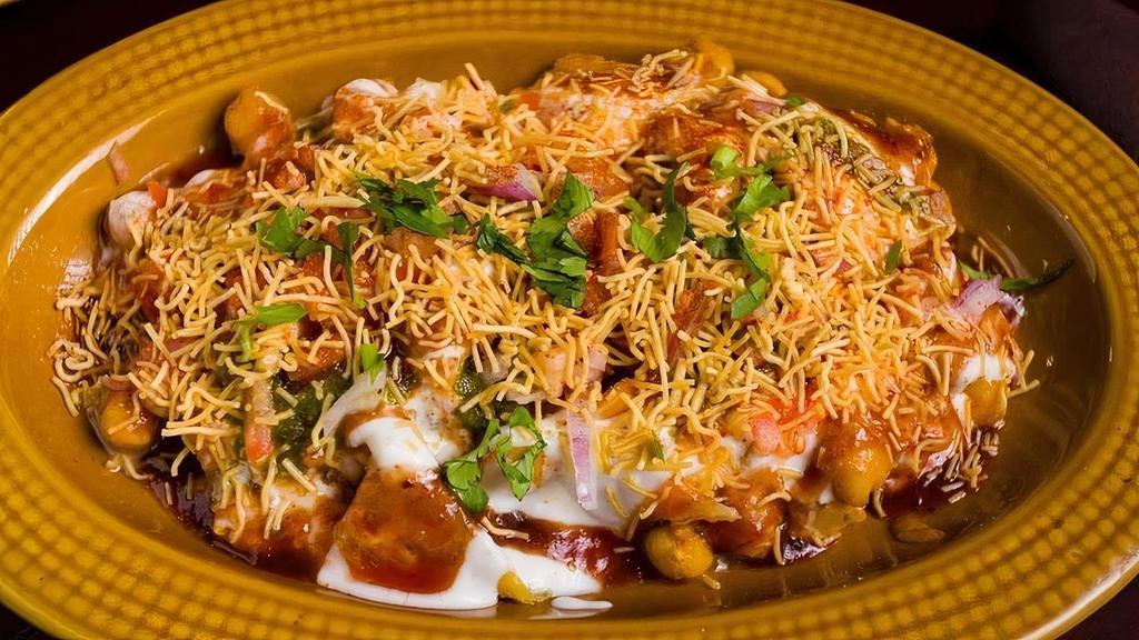 Delhi Aloo Tikki Chaat · Spiced Potatoes patties, chickpeas, yogurt and chutnies