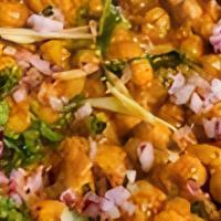 Chole · Curried chickpeas and garden herbs.