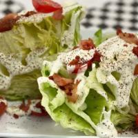 Wedge Salad · Crispy cured bacon, Bleu cheese, Cherry Tomatoes, Balsamic reduction