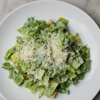 Caesar Salad · Crisp romaine lettuce, house Caesar dressing, garlic croutons and pecorino Romano.