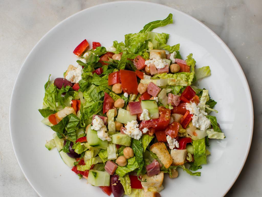 Mediterranean Chopped Salad · Red peppers, cucumbers, tomato, black olives, feta cheese, chickpeas, romaine lettuce, fresh lemon and extra virgin olive oil.