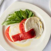 Caprese Salad · House made fresh mozzarella, beefsteak tomato, fresh basil drizzled with extra virgin olive ...