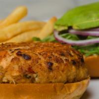 Salmon Burger · Side of orange chipotle mayonnaise, avocado slices, baby arugula, red onion, hand cut fries ...