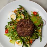 Bunless Burger Over Garden Salad · Mixed greens, tomato, cucumber, red onion, green beans, avocado and egg wedges.