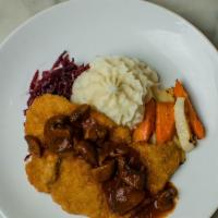 Pork Schnitzel · Breaded tender pork cutlet, wild mushroom Demi, sweet potato mash, roasted root vegetables a...