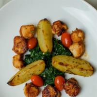 Sea Scallops · Sauteed spinach and lemon roasted red potatoes.