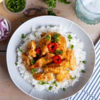 Chicken & Lamb Over Rice · Marinated and cooked Chicken & Lamb blended with a mix of spices, and served on a bed of med...