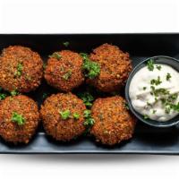Spicy Falafel Over Rice · Delicious Spicy Falafels served on a bed of mediterranean style rice.