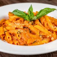 Penne Vodka · San Marzano tomatoes, heavy cream and vodka, slowly cooked and served over penne.