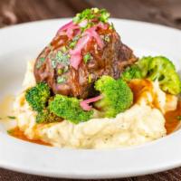 Short Rib · Slowly braised in red wine and spices, topped with horseradish gravy. Served with mac & chee...
